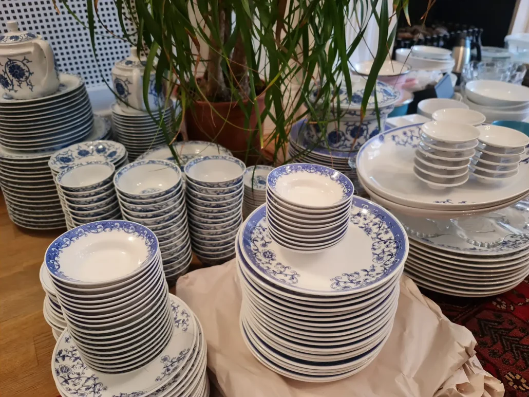 China dinner service laid out before packing