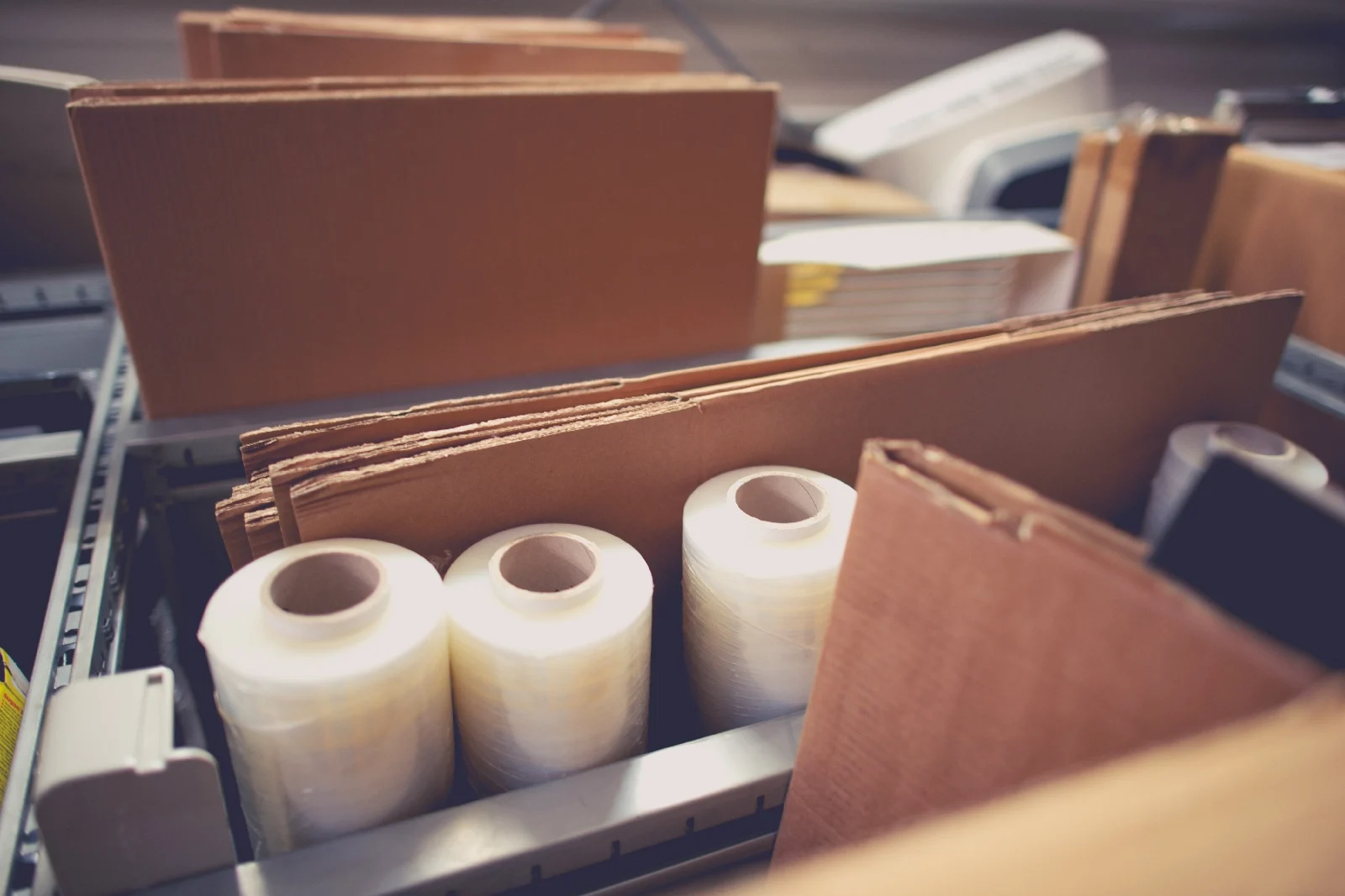 Cardboard and plastic packaging materials on shelves